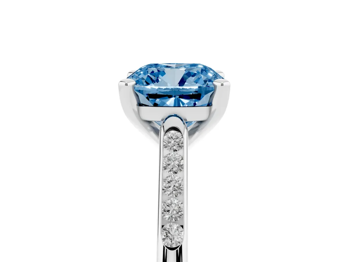 Fancy Blue Cushion Cut Diamond Solitaire Ring with Channel Set Round Band and Prong Setting Silver