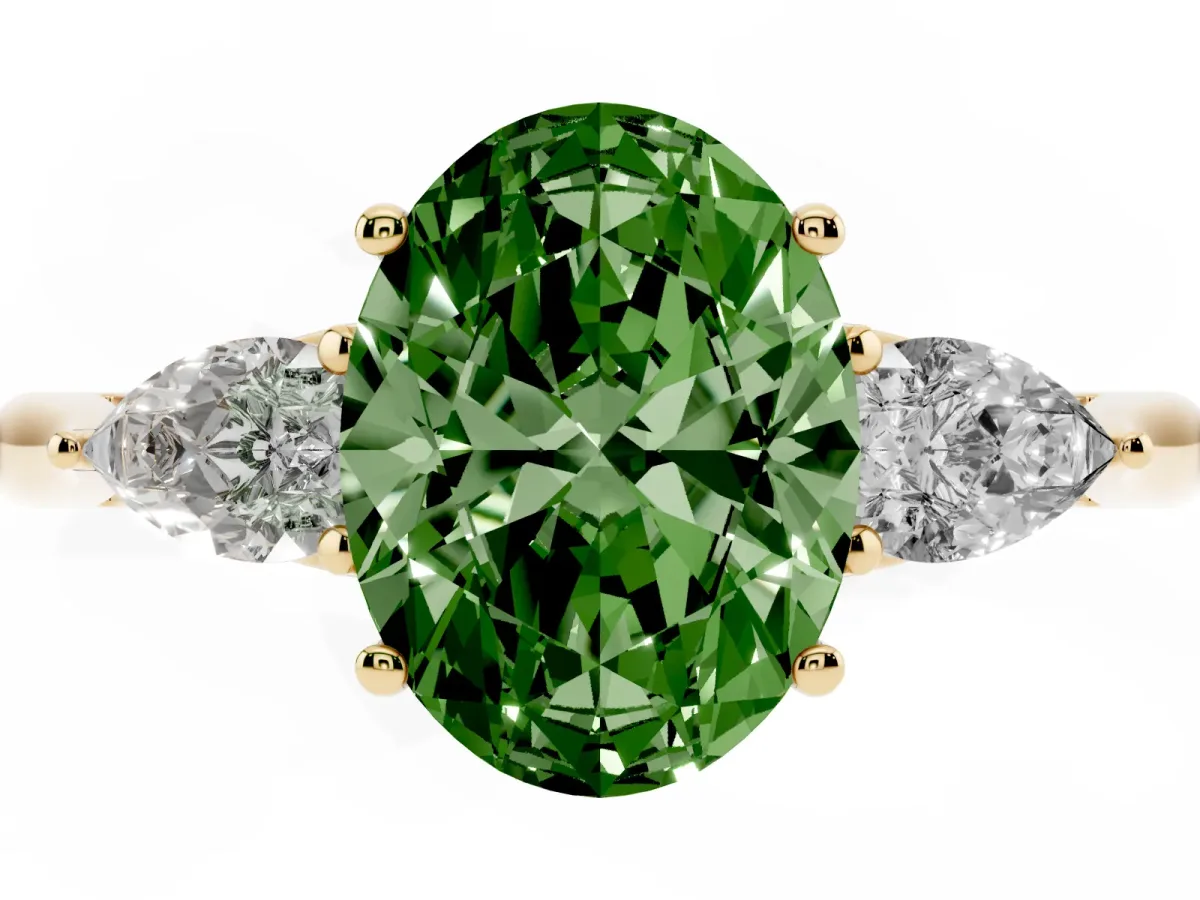 Fancy Green Three-Stone Oval Cut Diamond Ring with Pear Side Stones in Four-Prong Setting Yellow gold