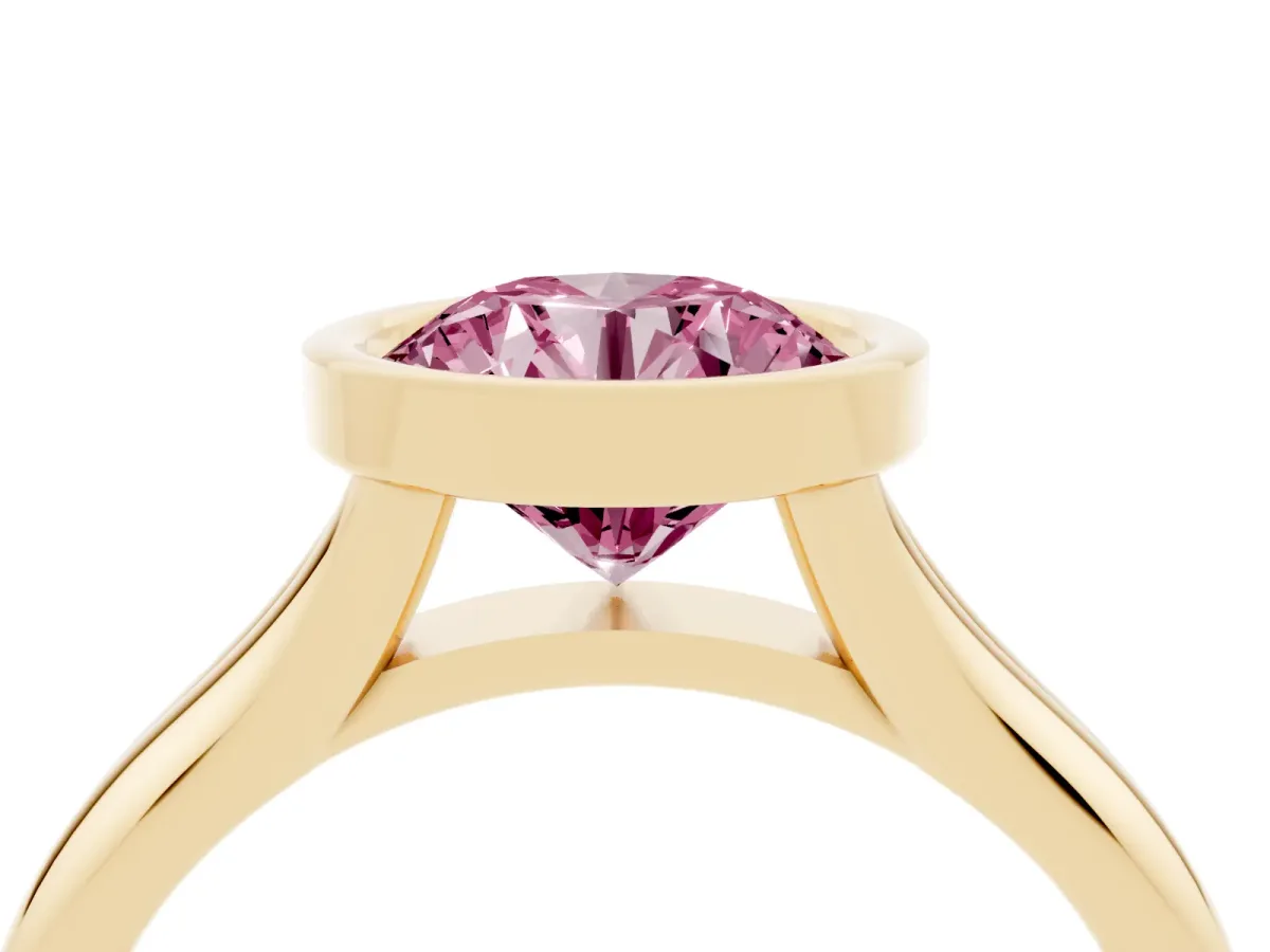 Fancy Pink Bezel Set Round Cut Solitaire Diamond Ring with Smooth Band Yellow gold
