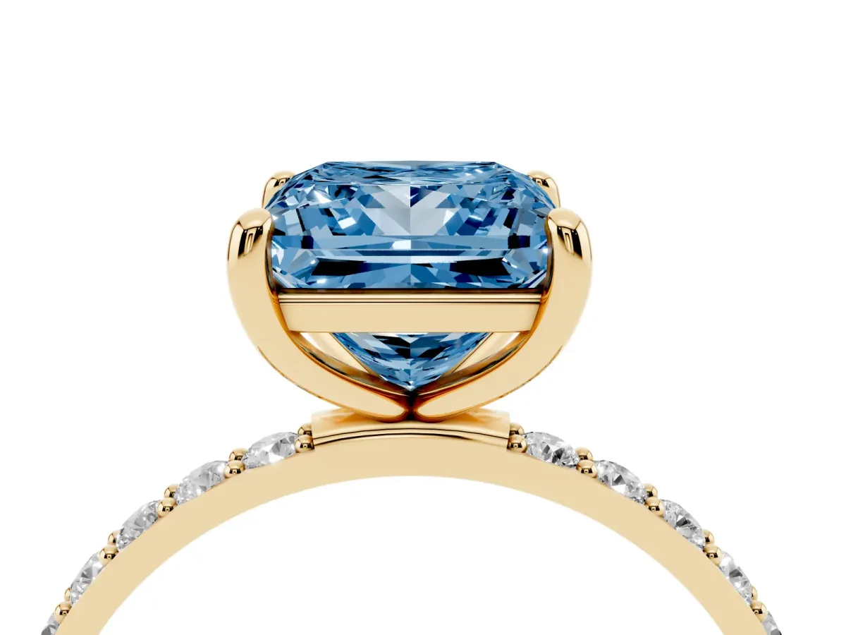 Fancy Blue Princess Cut Diamond Solitaire Ring with Round Pavé Band and Prong Setting Yellow gold
