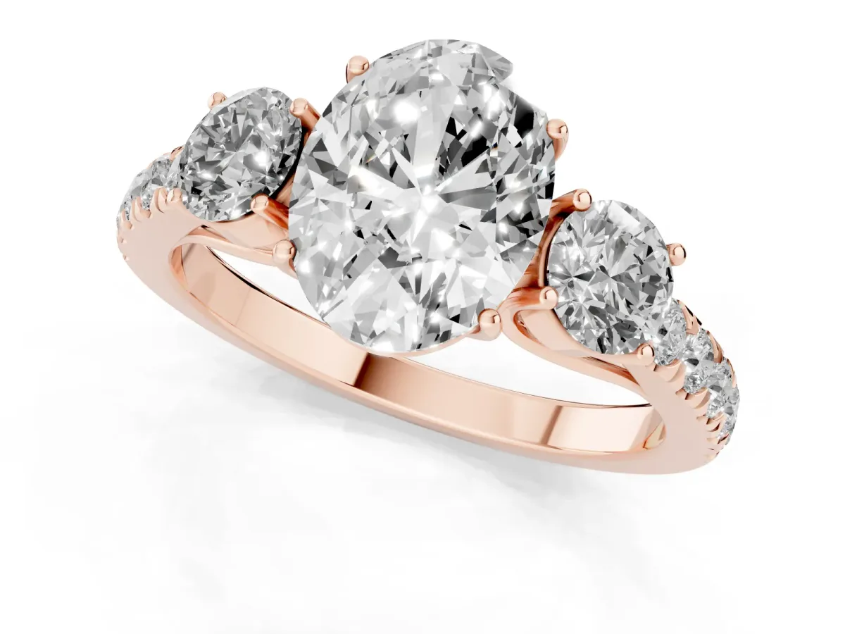 Oval Cut Cut Diamond Three-Stone Ring with Round Side Stones and Pavé Band Rose gold
