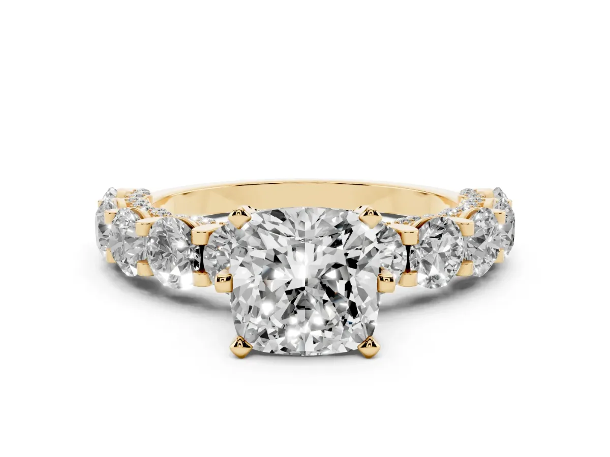 Cushion Cut Diamond Side Stone Engagement Ring with Four-Prong Setting Yellow gold