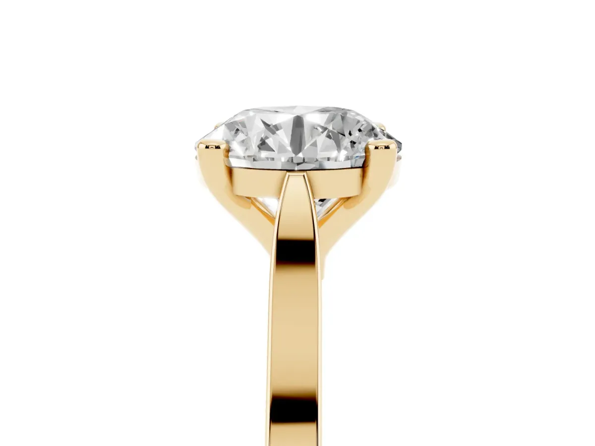 Round Cut Solitaire Diamond Ring with Four-Prong Setting and Tapered Band Yellow gold
