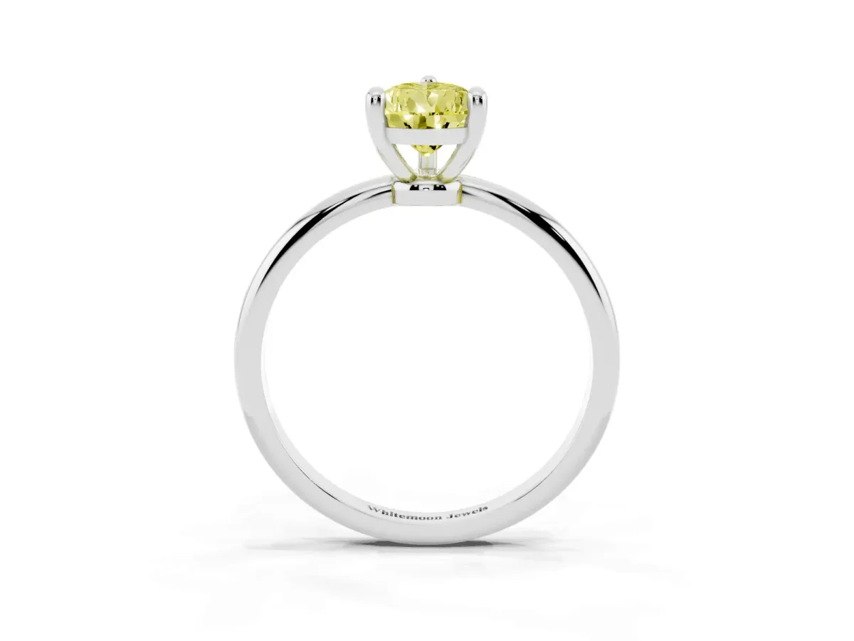 Fancy Yellow Pear Cut Solitaire Diamond Ring with 4-Prong Setting on a Classic Band Silver