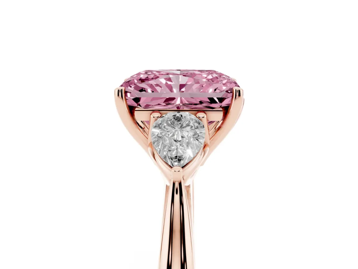 Fancy Pink Three-Stone Radiant Cut Diamond Ring with Pear Side Stones in Four-Prong Setting Rose gold