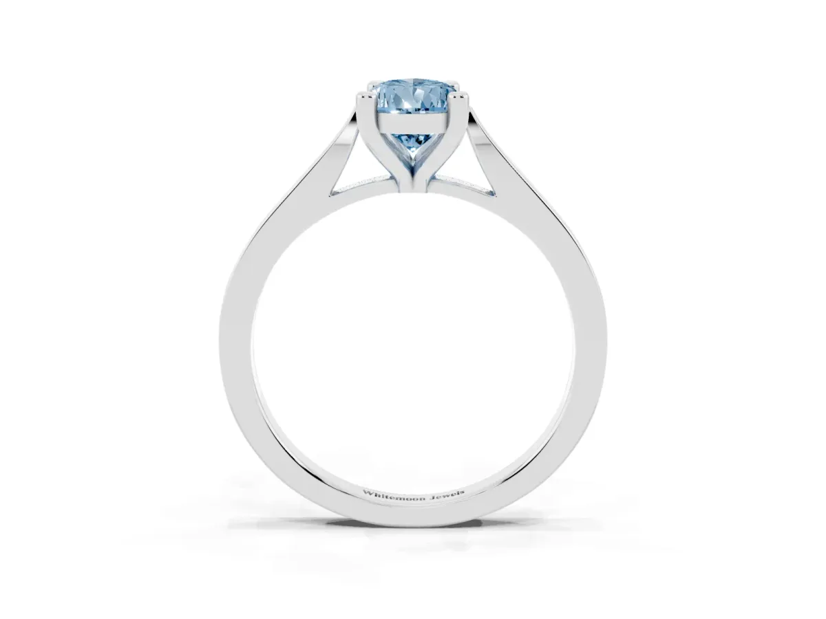 Fancy Blue Pear Cut Solitaire Diamond Ring with Four-Prong Setting and Tapered Band Platinum