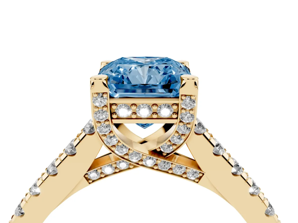Fancy Blue Radiant Cut Brilliant Diamond Solitaire with Pavé Band and Four-Prong Setting Yellow gold