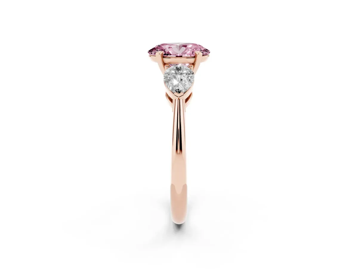 Fancy Pink Three-Stone Oval Cut Diamond Ring with Pear Side Stones and Four-Prong Setting Rose gold