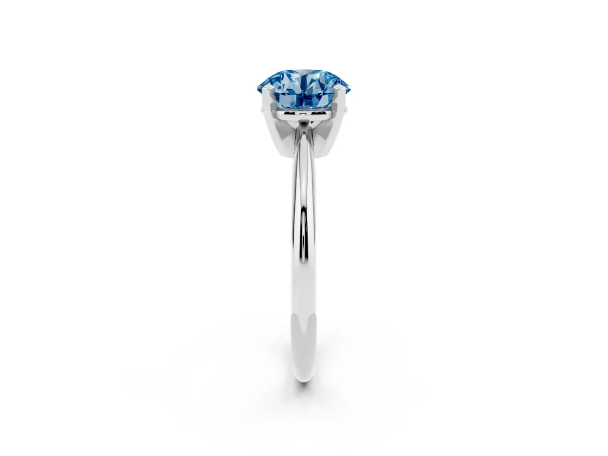 Fancy Blue Round Cut Cut Solitaire Ring with Four-Prong Setting on a Classic Band Silver
