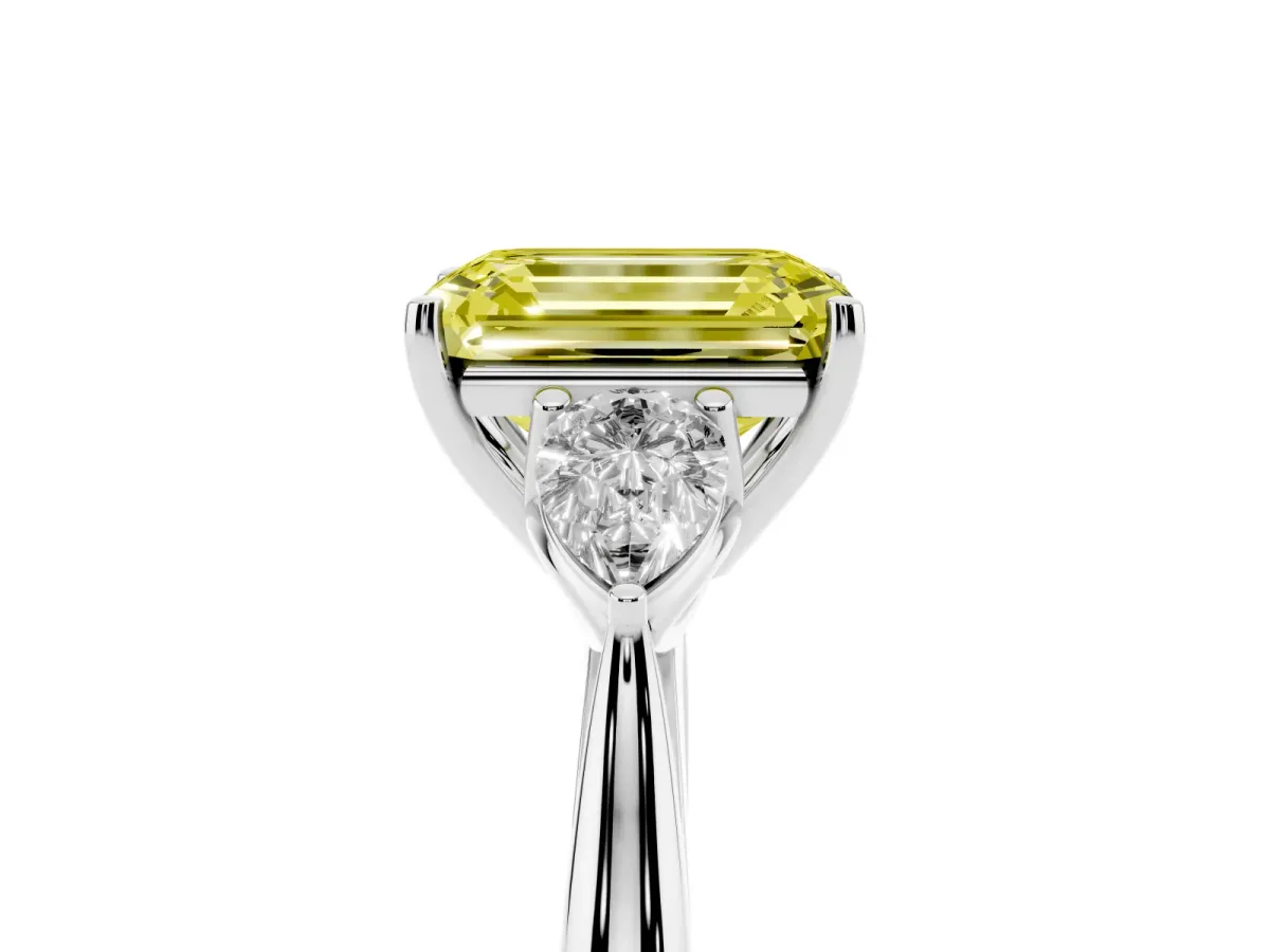 Fancy Yellow Three-Stone Emerald Cut Brilliant Diamond Solitaire Ring with Tapered Band and Four-Prong Setting Platinum