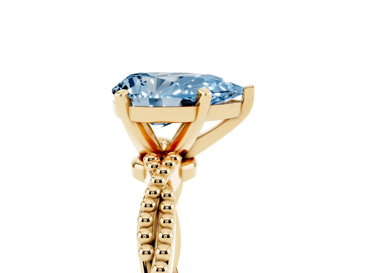 Fancy Blue Pear Cut Solitaire Twisted Band with Bead Prong Setting Yellow gold