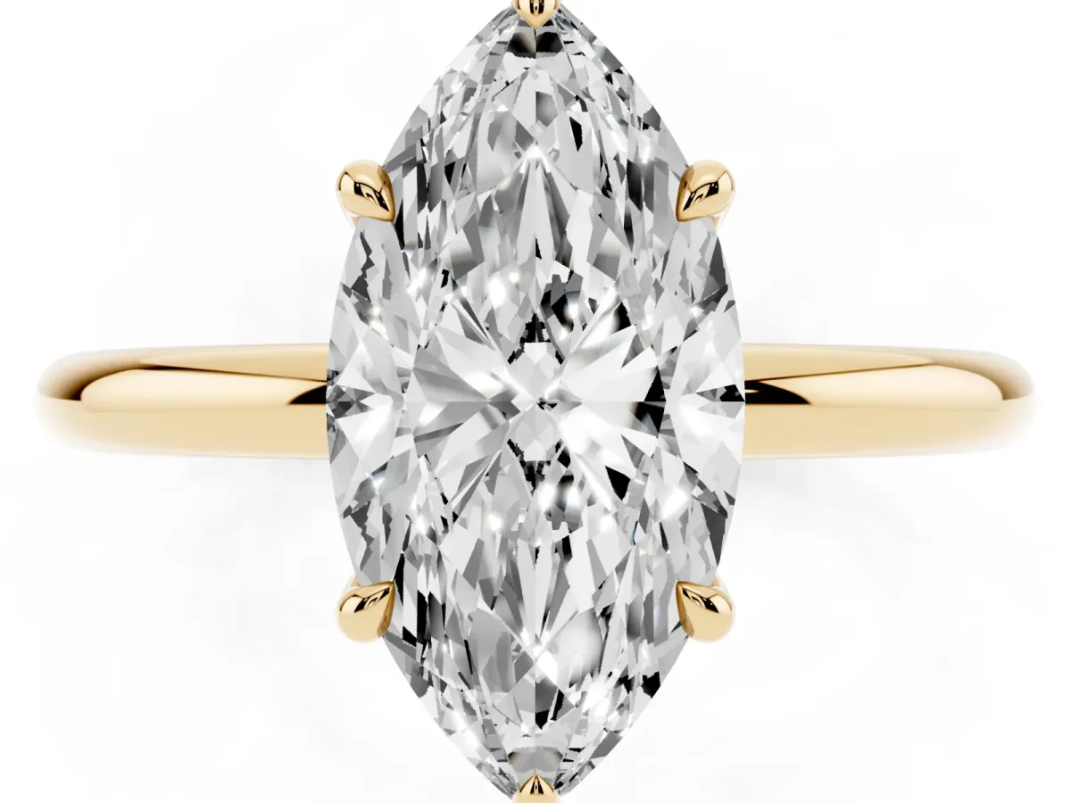 Marquise Cut Diamond Solitaire Ring with Thin Band and Four-Prong Setting Yellow gold