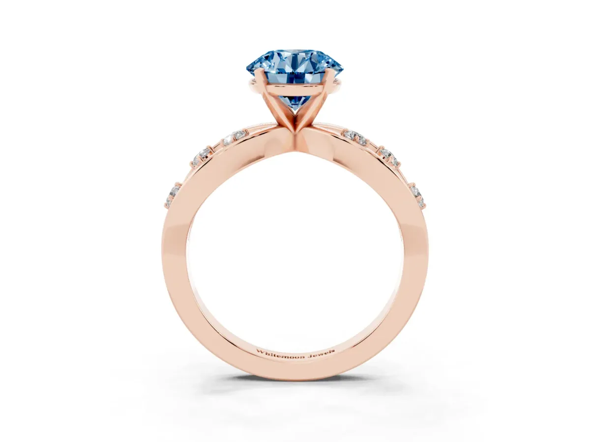 Fancy Blue Round Cut Cut Solitaire Diamond with Side Stones on Criss-Cross Band and Four-Prong Setting Rose gold