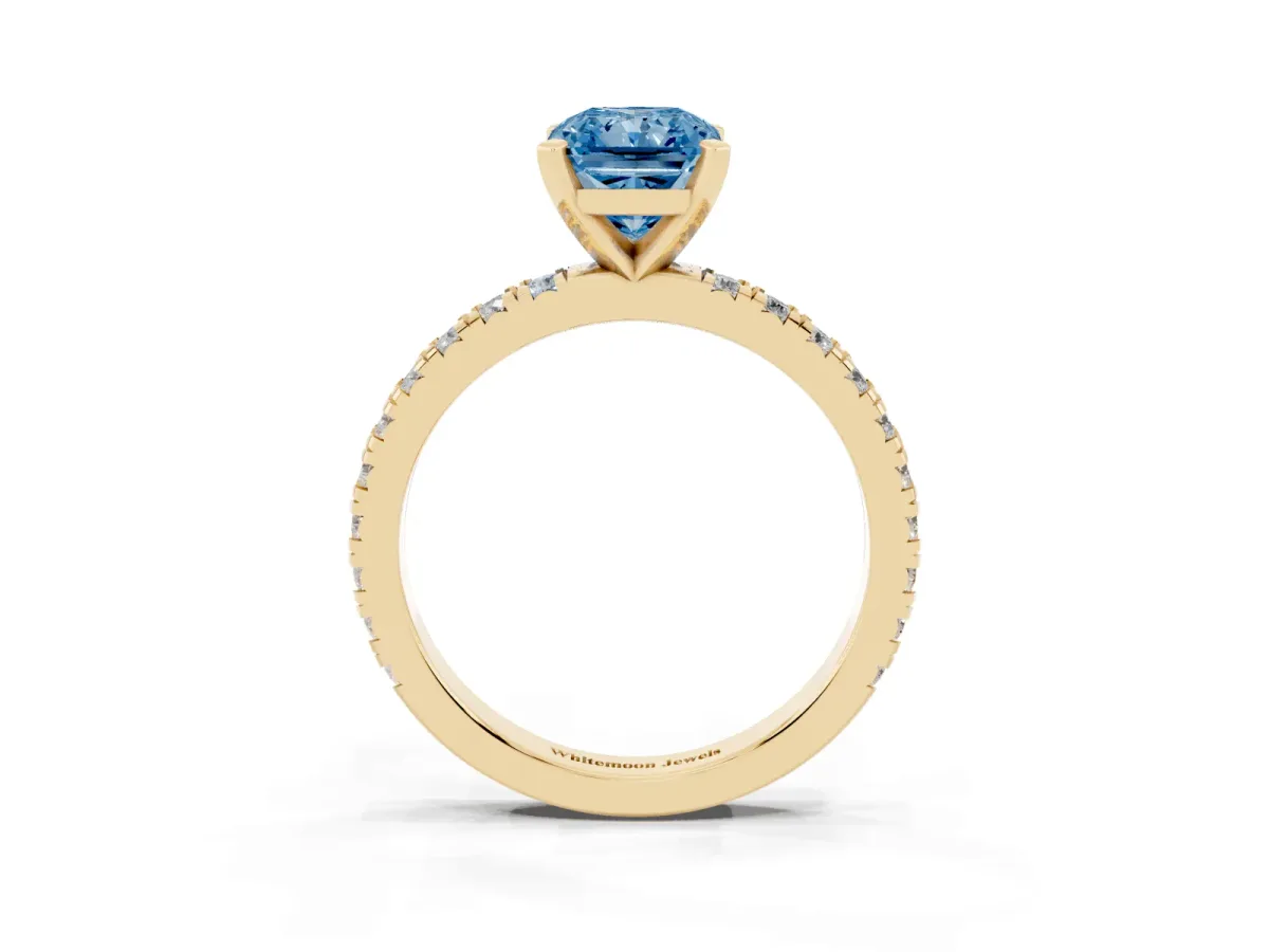 Fancy Blue Radiant Cut Diamond Pavé Band Solitaire with Four-Prong Setting Yellow gold