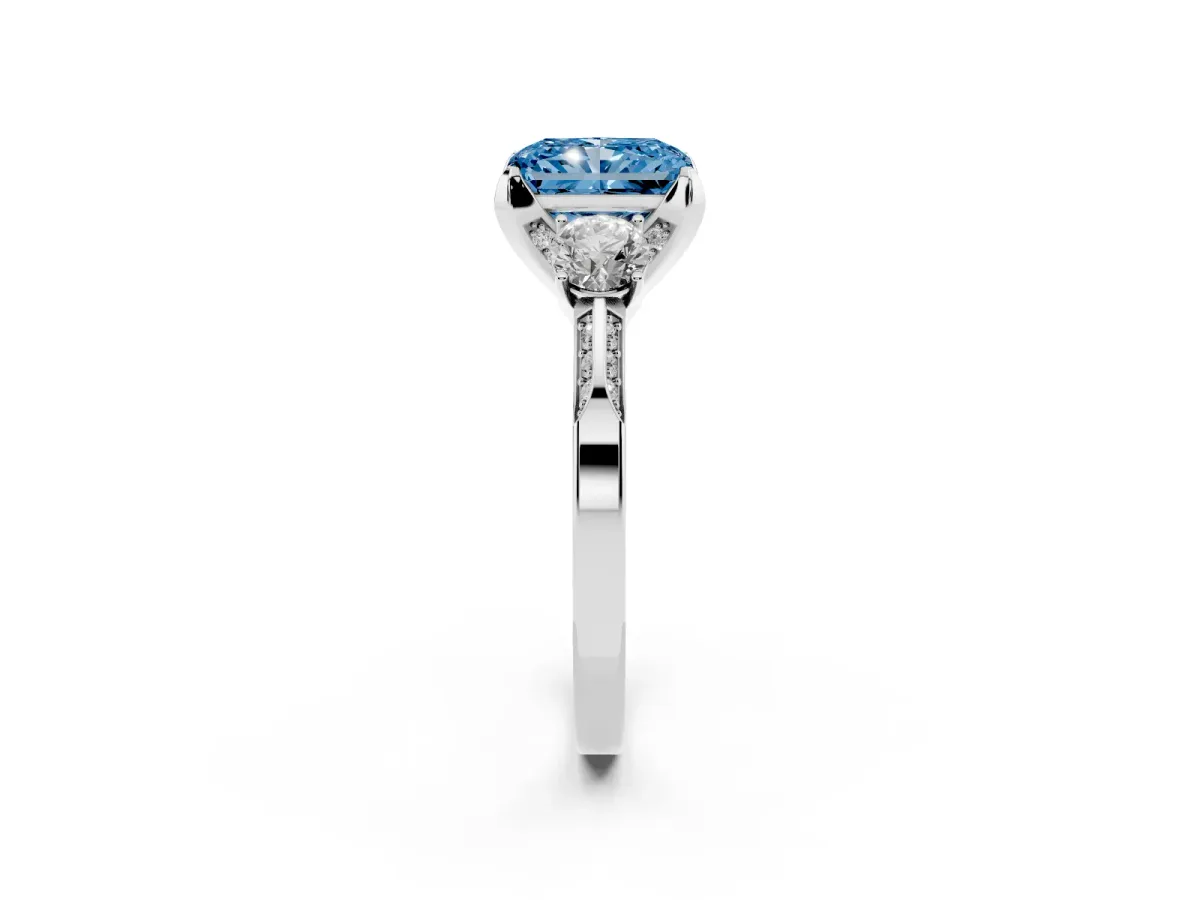 Fancy Blue Radiant Cut Brilliant Three-Stone Diamond Ring with Pavé Band and Four-Prong Setting Silver