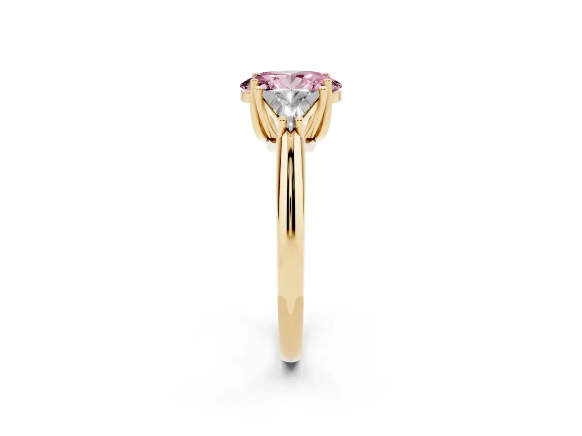 Fancy Pink Three-Stone Oval Cut Diamond Engagement Ring with Trillion Side Stones and Prong Setting Yellow gold