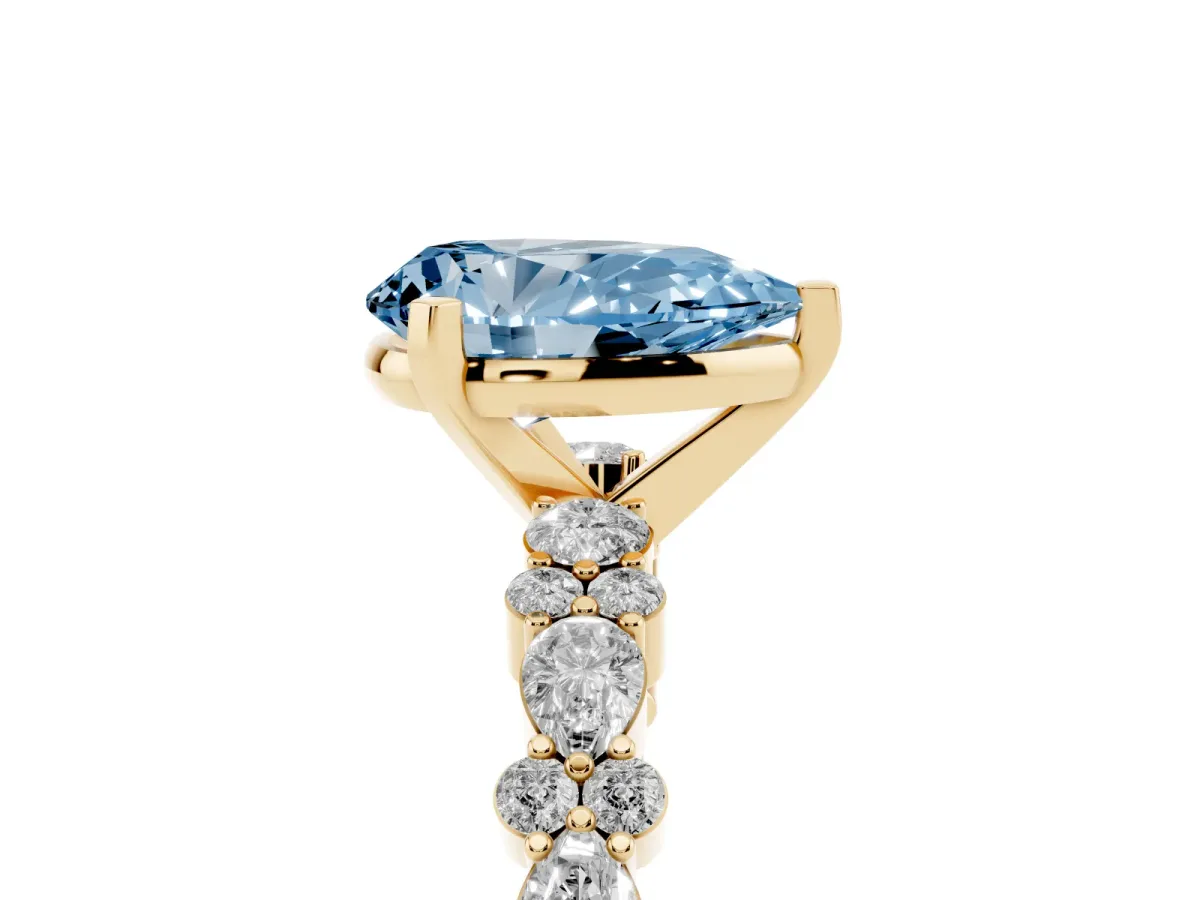 Fancy Blue Pear Cut Diamond Side Stone Solitaire Ring with Round and Four-Prong Setting Yellow gold