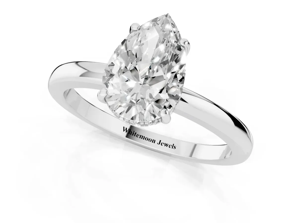 Pear Cut Solitaire Diamond Ring with Prong Setting and Plain Band Platinum