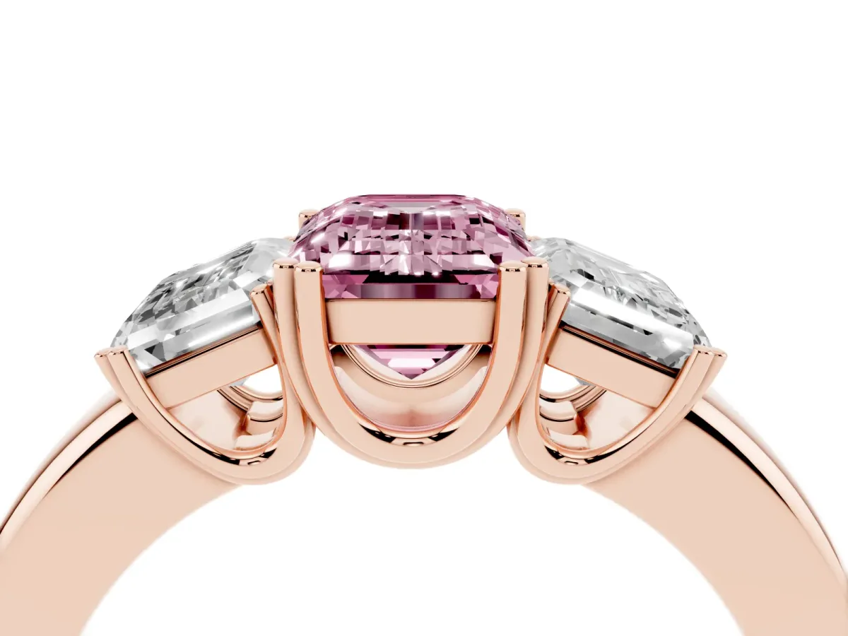 Fancy Pink Three-Stone Emerald Cut Cut Diamond Ring with Channel Set Band and Four-Prong Setting Rose gold