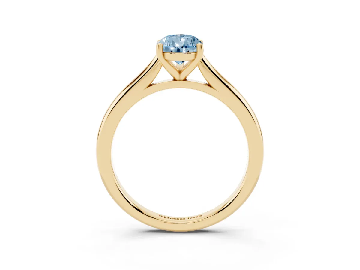 Fancy Blue Pear Cut Cut Solitaire Ring with Cathedral Band and Four-Prong Setting Yellow gold