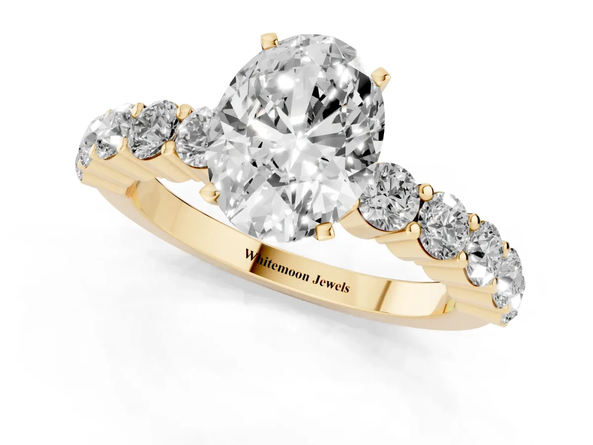 Oval Cut Diamond Solitaire Ring with Shared Prong Round Side Stones Yellow gold