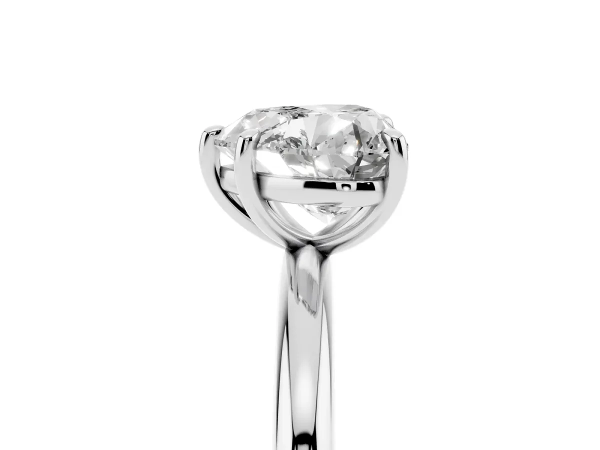 Heart Cut Solitaire Diamond Ring with Four-Prong Setting on a Plain Band Platinum