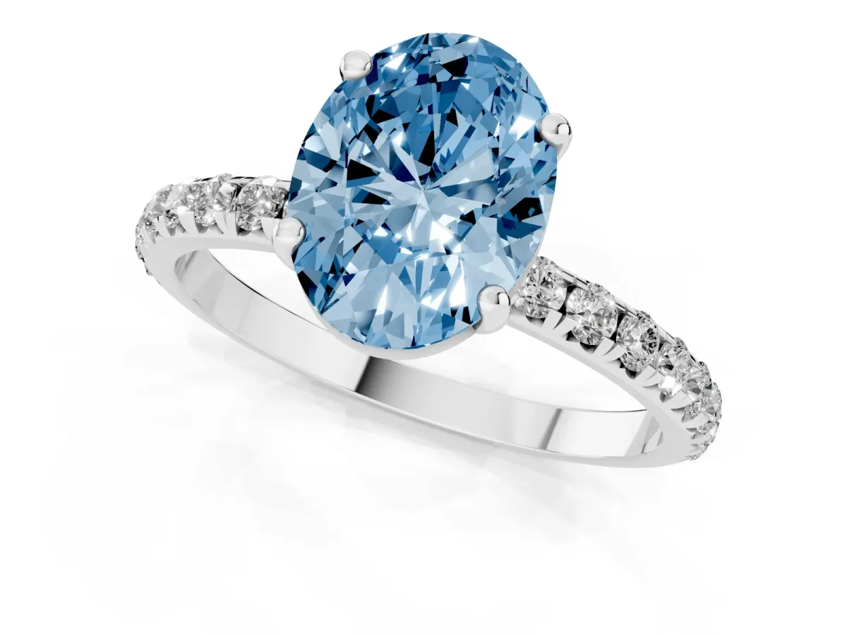 Fancy Blue Oval Cut Cut Diamond Solitaire Ring with Micro Pave Band and Four Prong Setting Silver