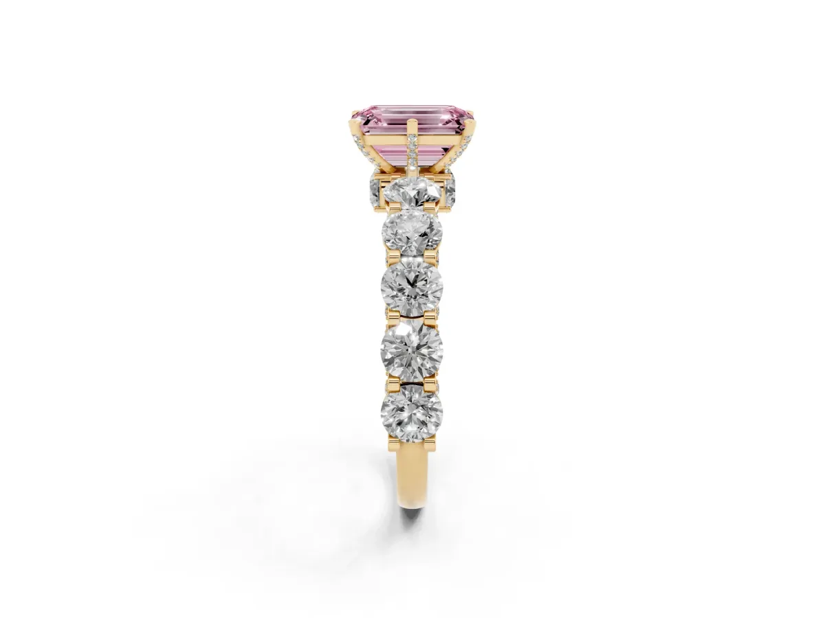 Fancy Pink Emerald Cut Diamond Side Stone Engagement Ring with Four-Prong Setting Yellow gold