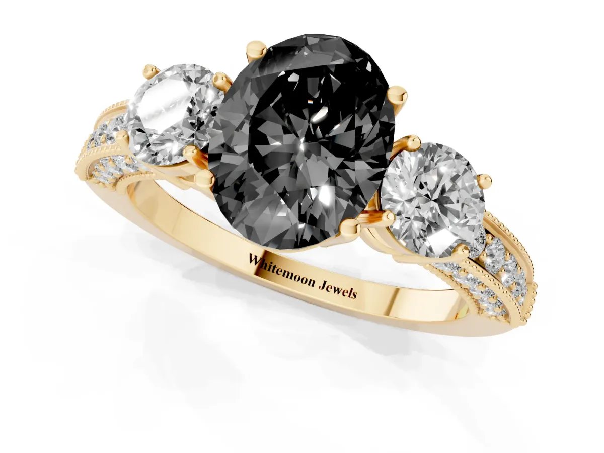 Fancy Black Oval Cut Three-Stone Diamond Ring with Pavé Band and Four-Prong Setting Yellow gold
