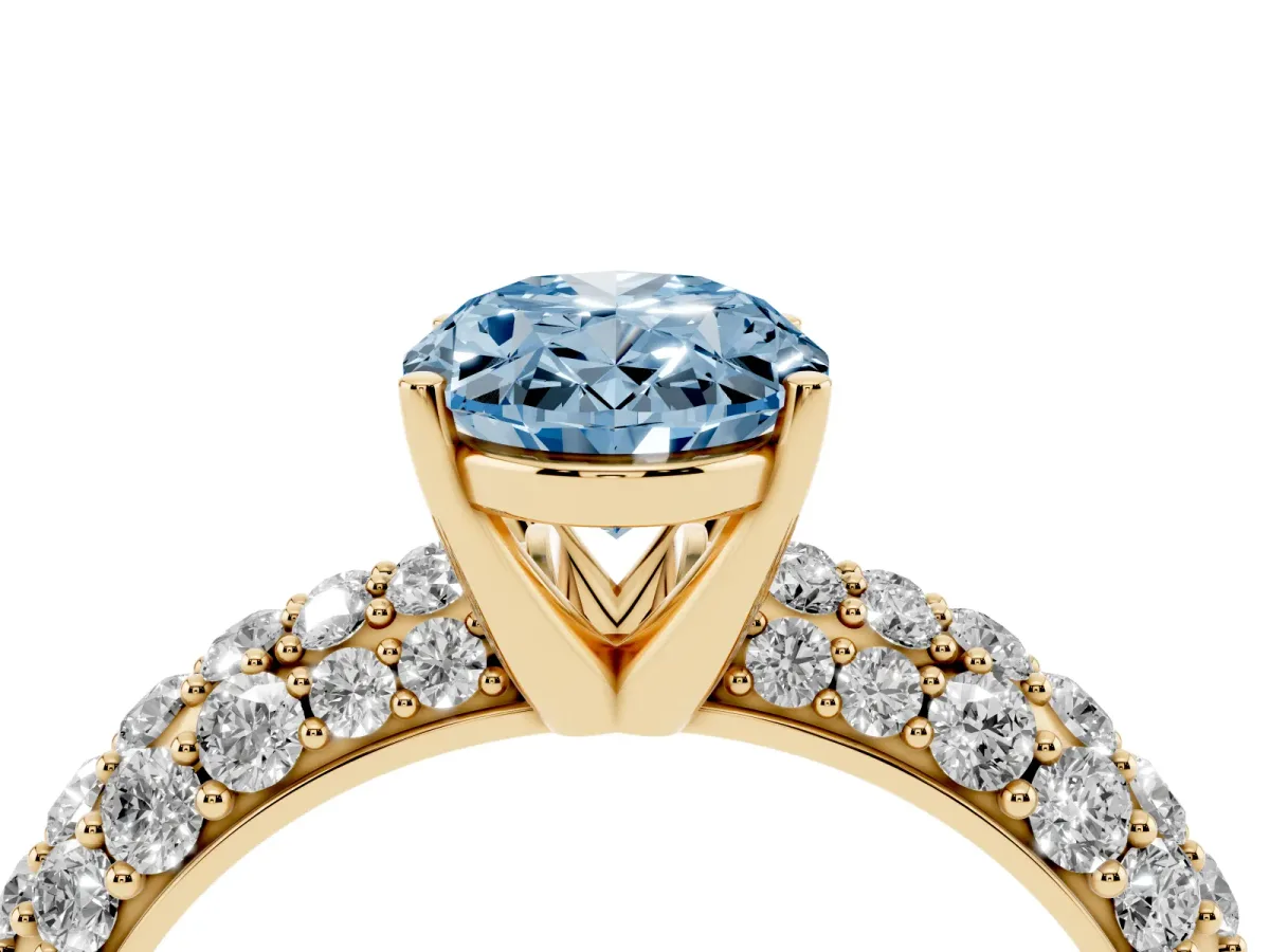 Fancy Blue Oval Cut Diamond Pavé Band Solitaire Ring with Four-Prong Setting Yellow gold
