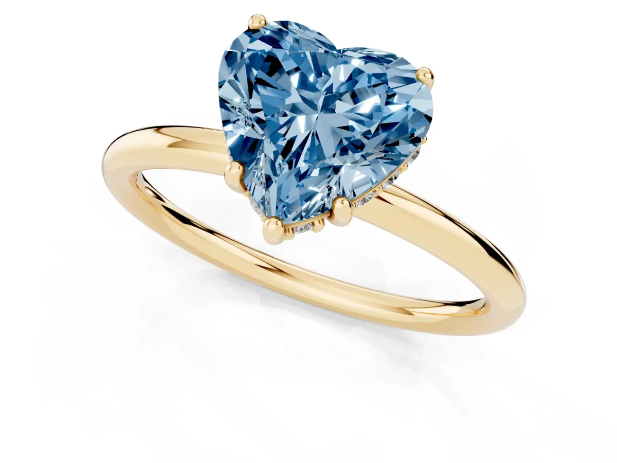Fancy Blue Heart Cut Solitaire Diamond Ring with a Classic Band and Four-Prong Setting Yellow gold