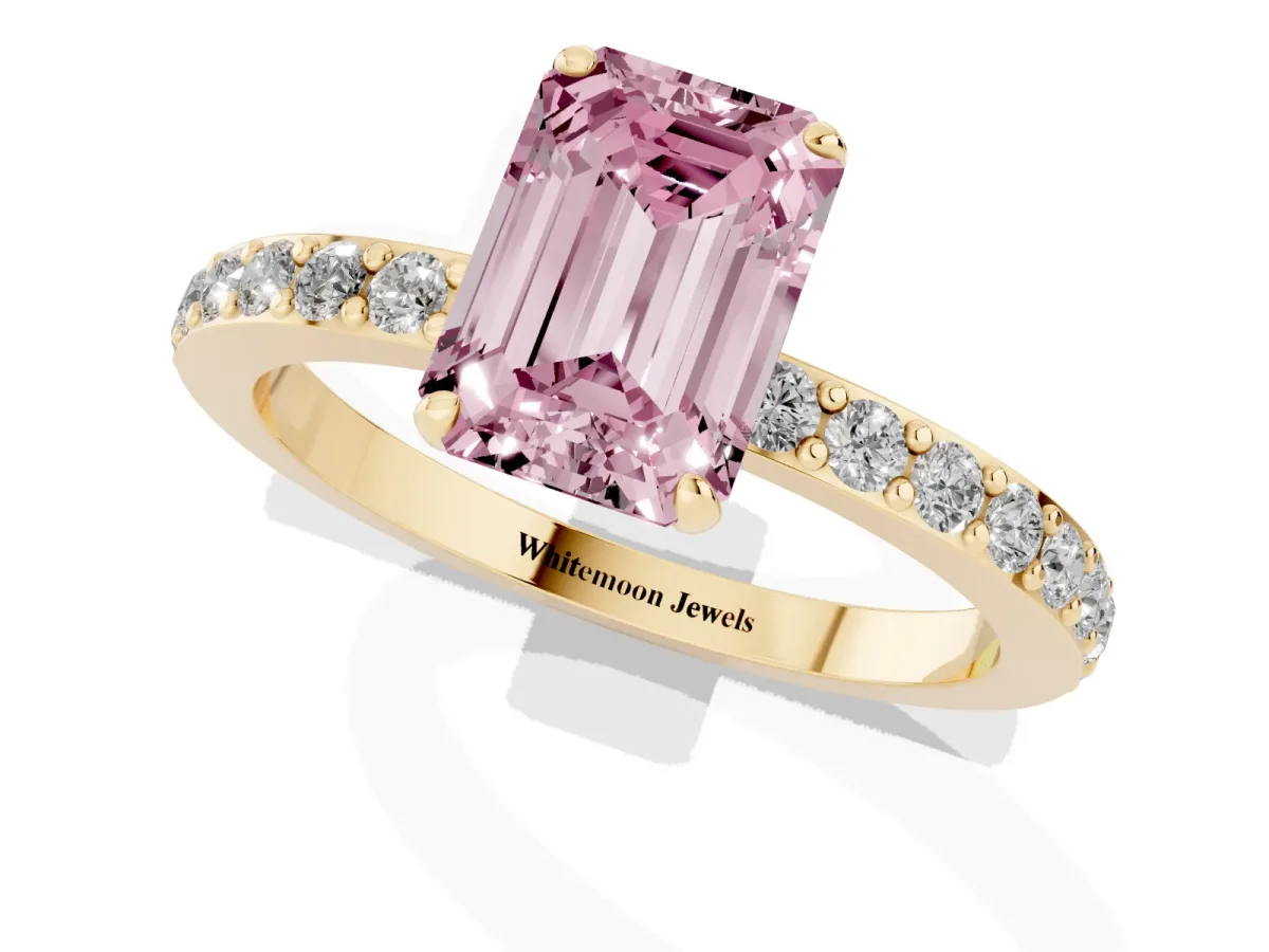 Fancy Pink Emerald Cut Diamond Pavé Engagement Ring with Round Accents and Prong Setting Yellow gold