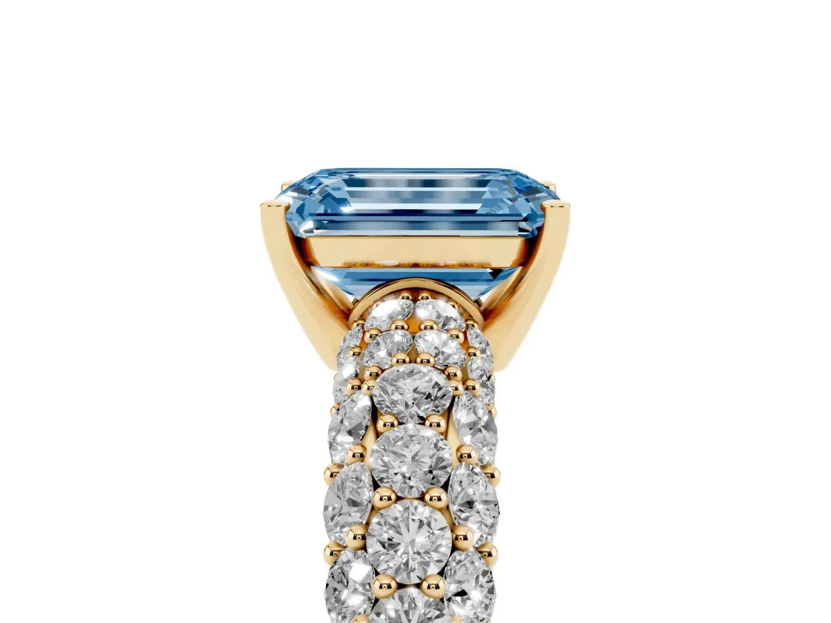 Fancy Blue Emerald Cut Diamond Pavé Band Solitaire Ring with Four-Prong Setting Yellow gold