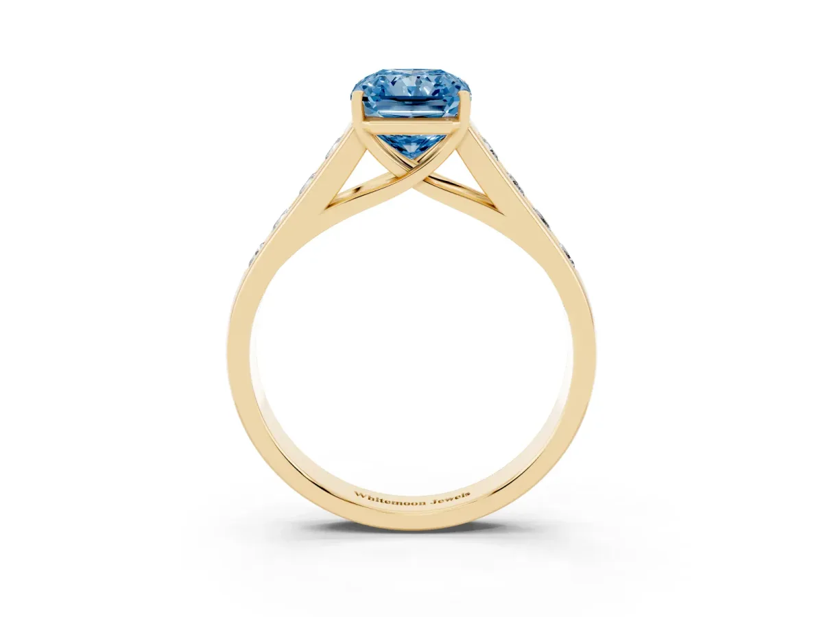 Fancy Blue Radiant Cut Solitaire Channel-Set Diamond Engagement Ring with Four-Prong Setting Yellow gold