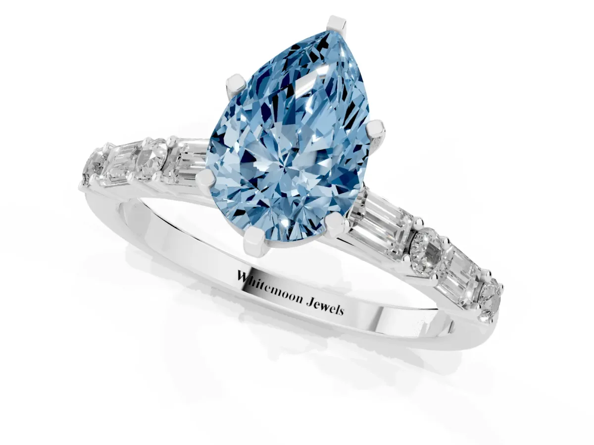 Fancy Blue Pear Cut Diamond Solitaire with Side Baguettes and Channel Set Band Silver