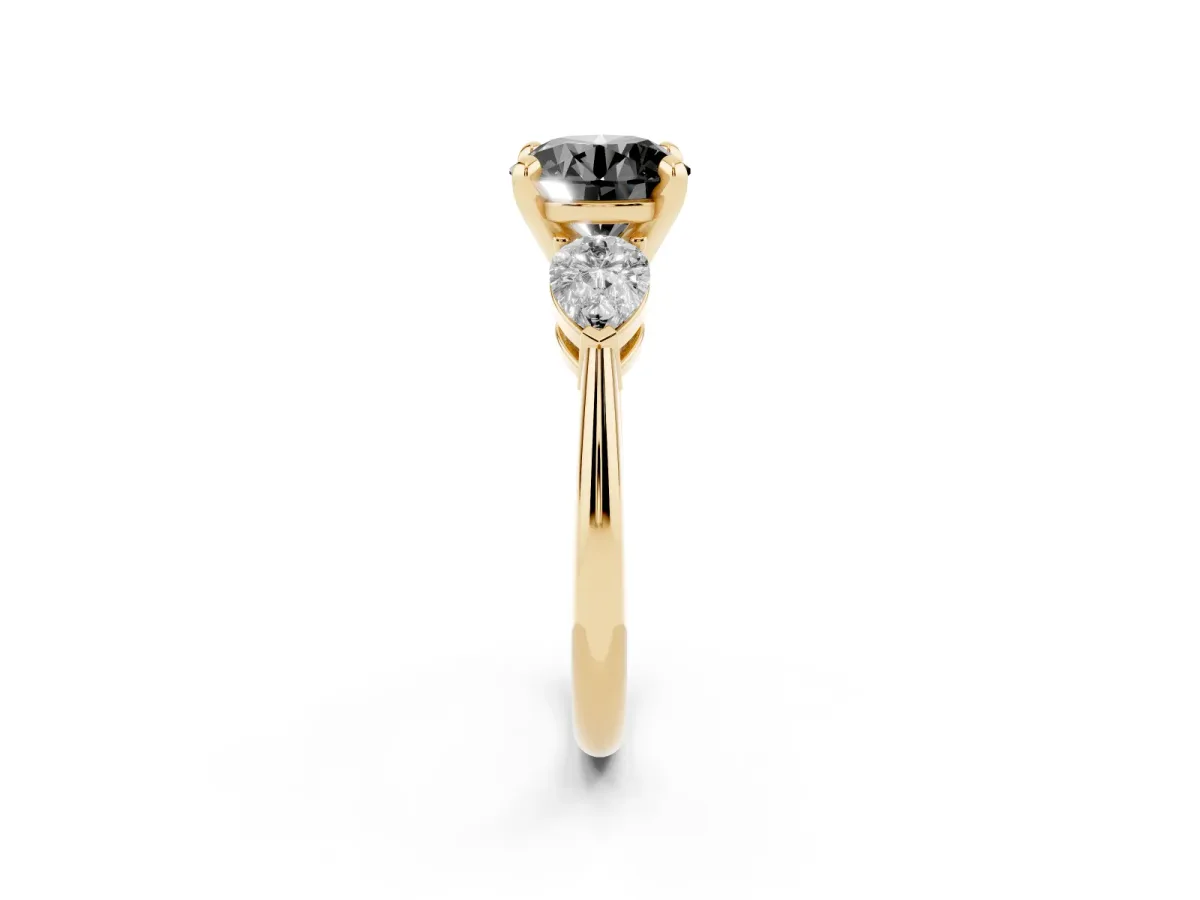 Fancy Black Three-Stone Round Cut Diamond Ring with Pear Side Stones and Four-Prong Setting Yellow gold