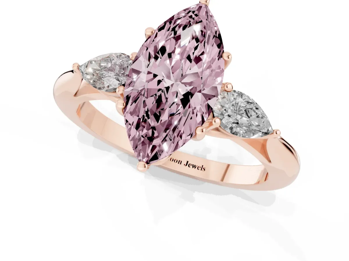 Fancy Pink Three-Stone Marquise Cut Diamond Ring with Pear Side Stones in Four-Prong Setting Rose gold