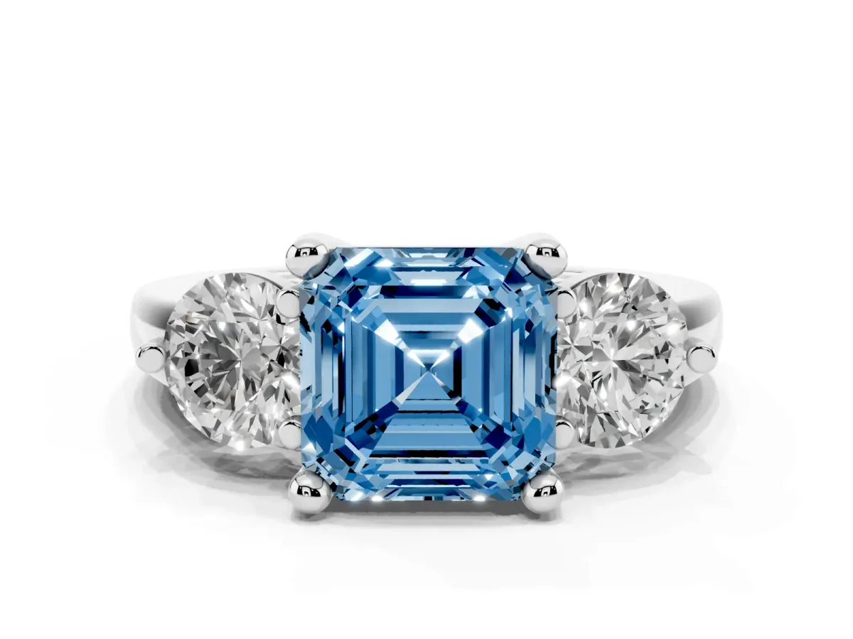 Fancy Blue Three-Stone Asscher Cut Brilliant Cut Solitaire Ring with Prong Setting on a Classic Band Platinum