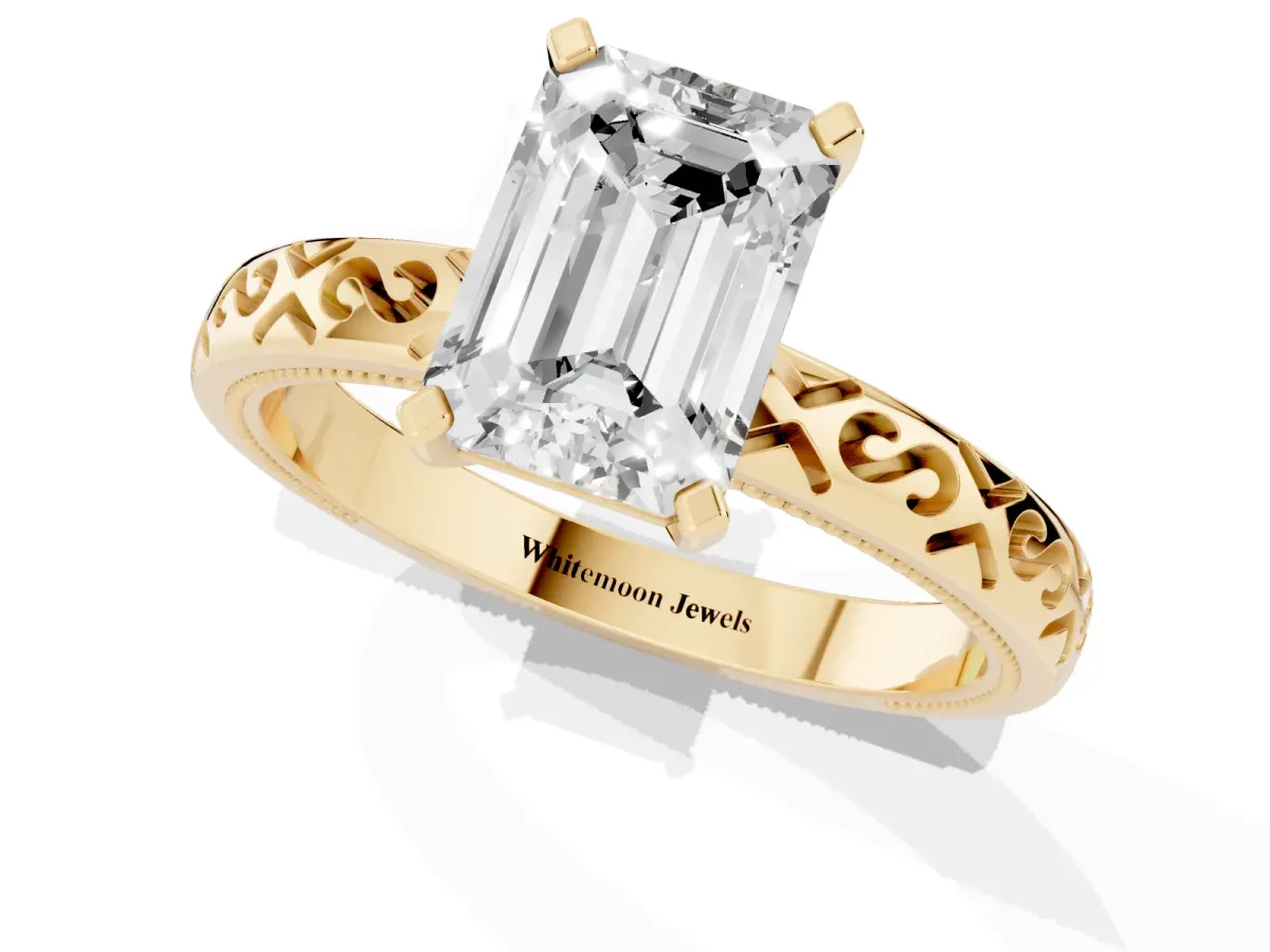 Emerald Cut Solitaire Engagement Ring with Scrollwork Band and Four-Prong Setting Yellow gold