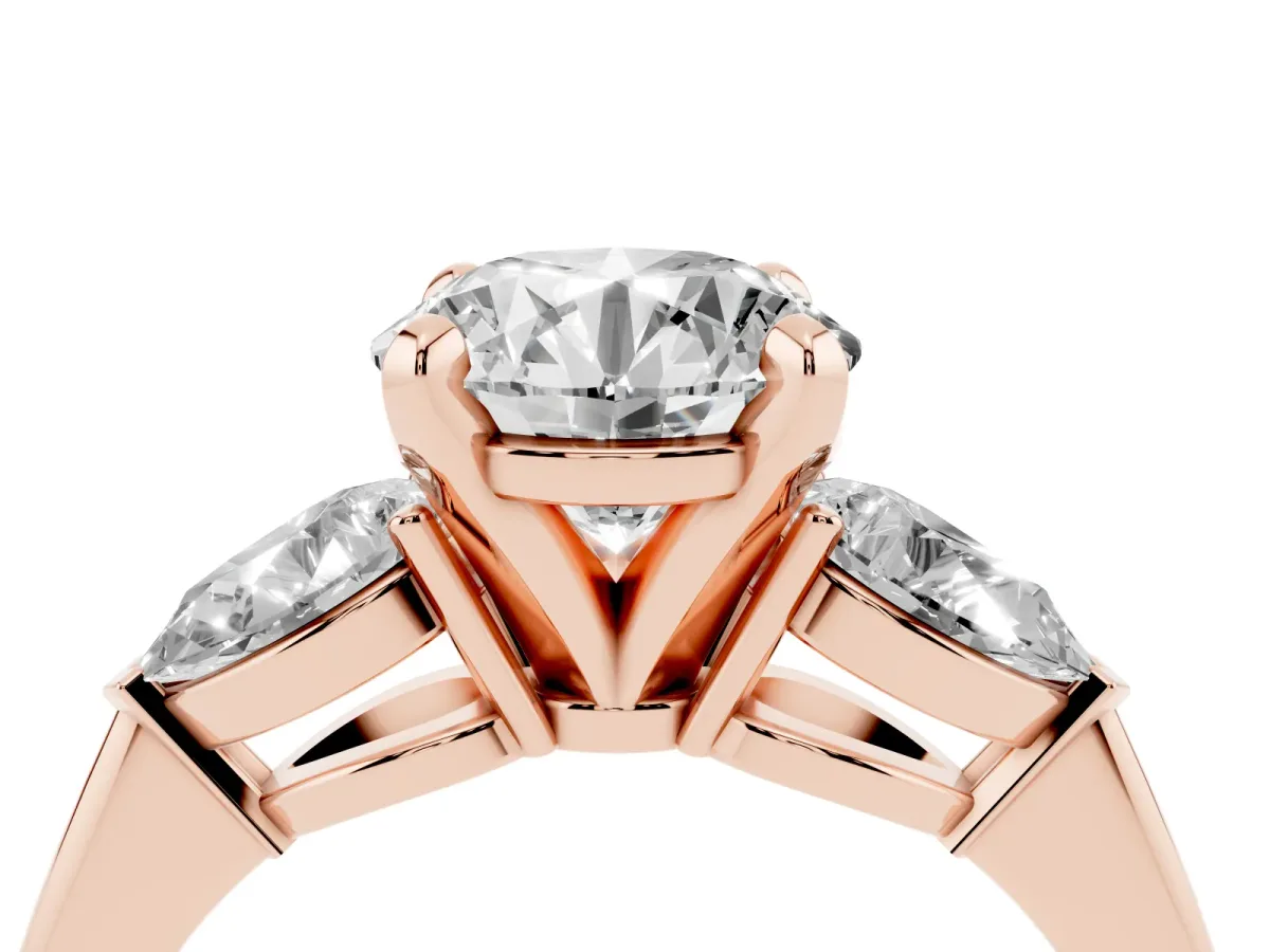 Three-Stone Round Cut Diamond Ring with Pear Side Stones and Four-Prong Setting Rose gold