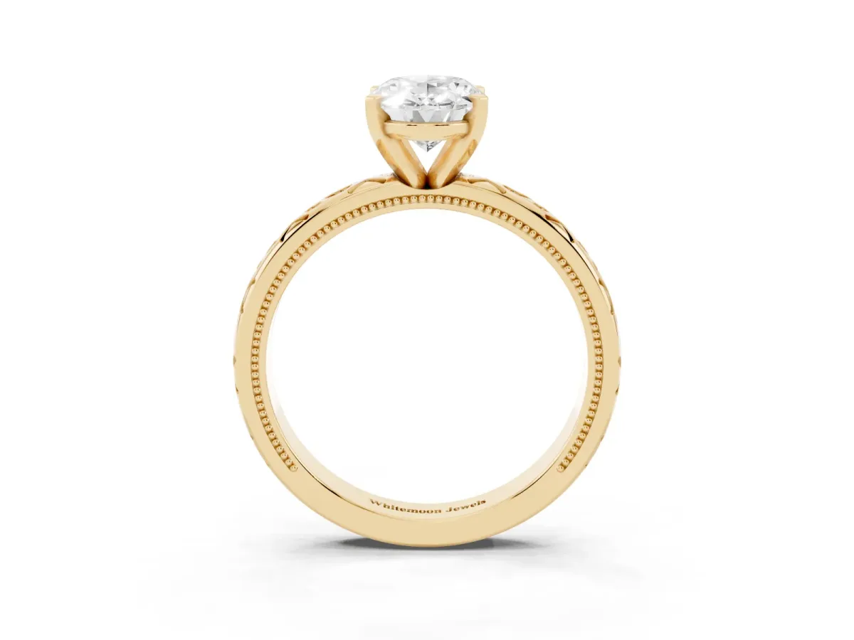 Oval Cut Solitaire Engagement Ring with Scrollwork Band and Four-Prong Setting Yellow gold
