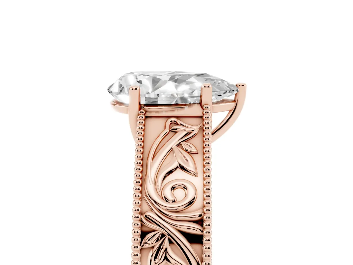 Pear Cut Diamond Solitaire Ring with Engraved Band and Four-Prong Setting Rose gold