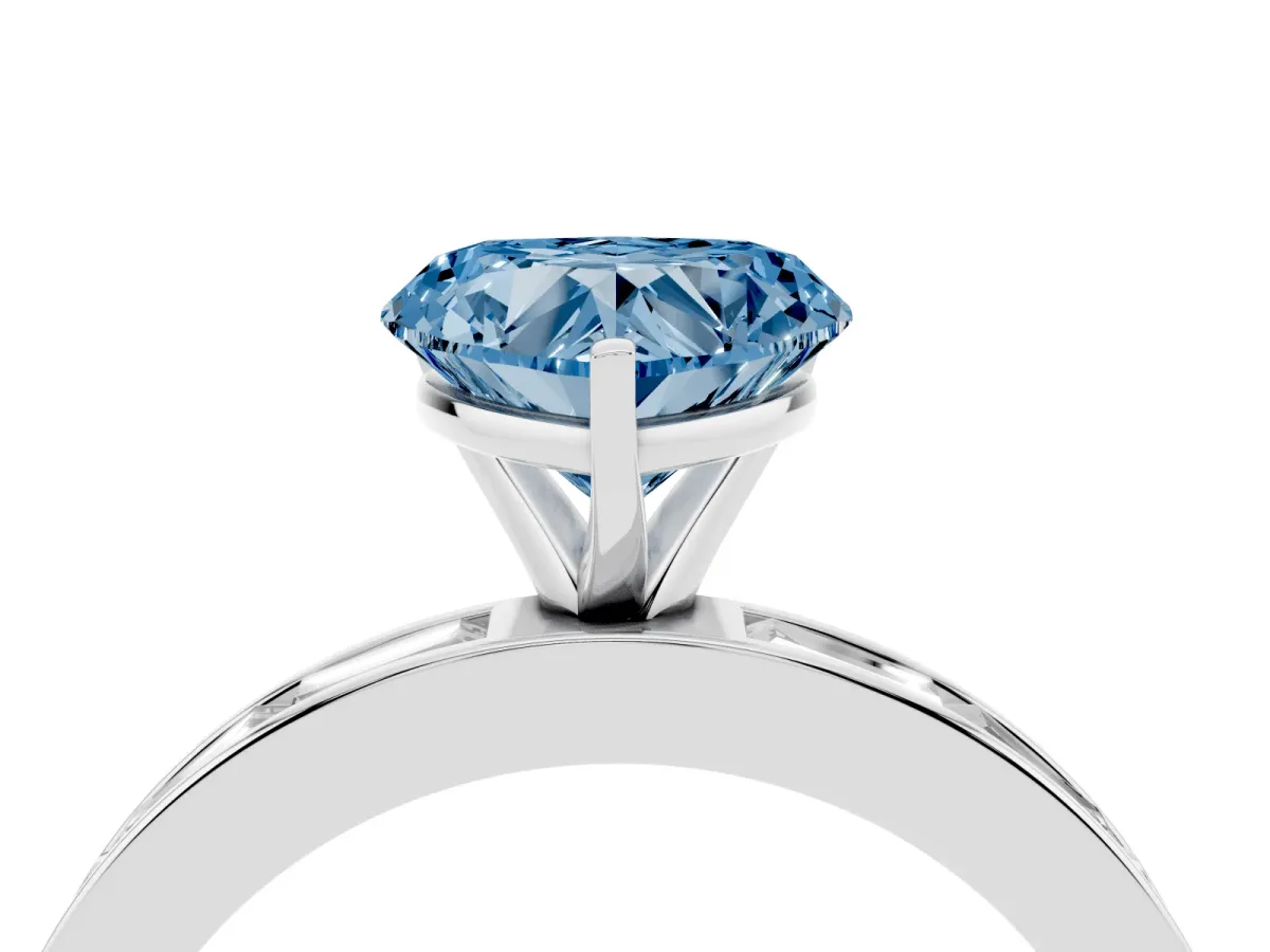 Fancy Blue Heart Cut Solitaire Diamond Ring with Channel-Set Baguette Band and Four-Prong Setting Platinum