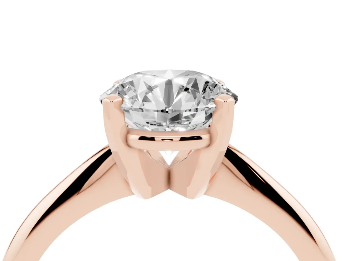 Round Cut Cut Solitaire Ring with Four-Prong Setting on a Classic Band Rose gold