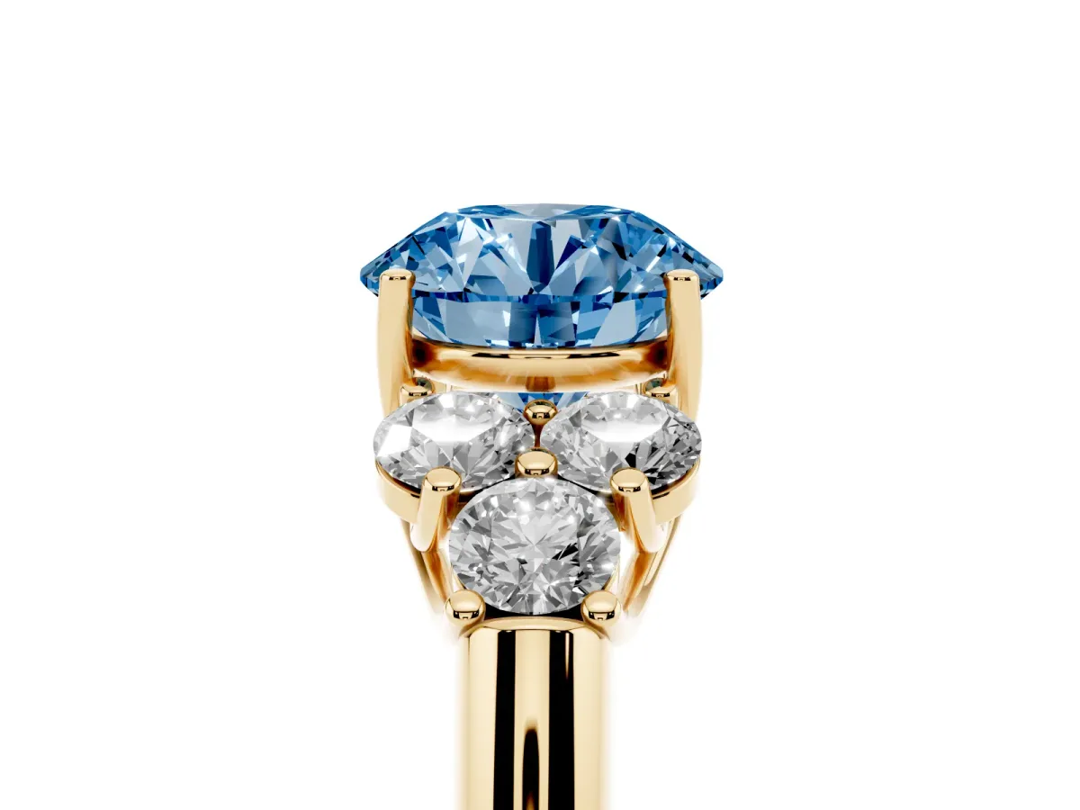 Fancy Blue Round Cut Cut Diamond Cluster Ring with Round Accent Stones and Prong Setting on a Classic Band Yellow gold