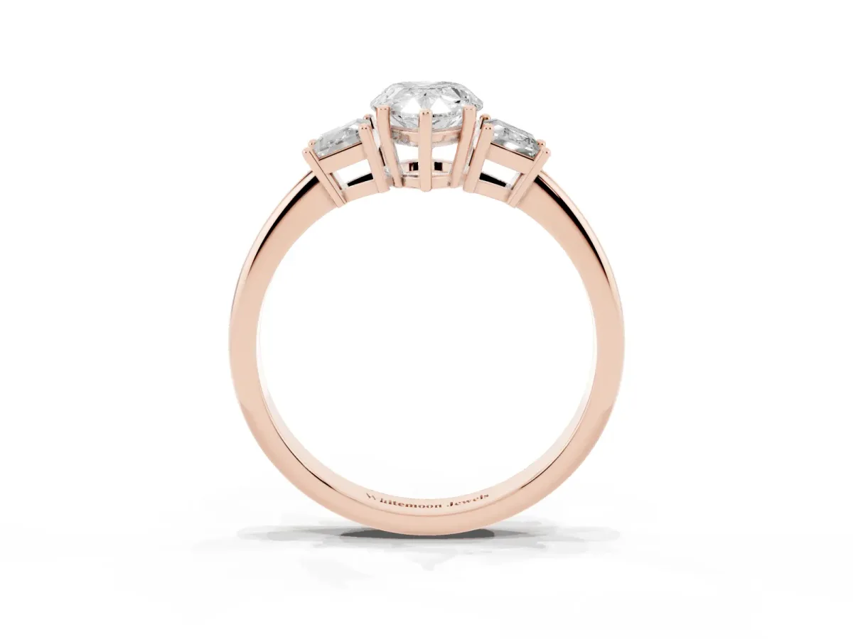 Pear Cut Diamond Three-Stone Ring with Trapezoid Side Stones and Prong Setting Rose gold