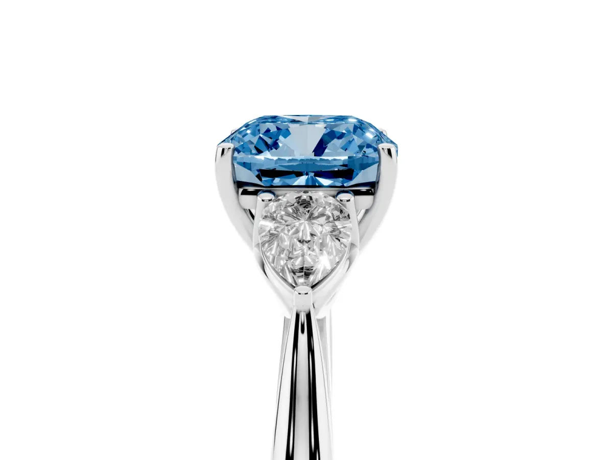Fancy Blue Three-Stone Cushion Cut Diamond Ring with Pear Side Stones in Four-Prong Setting Silver