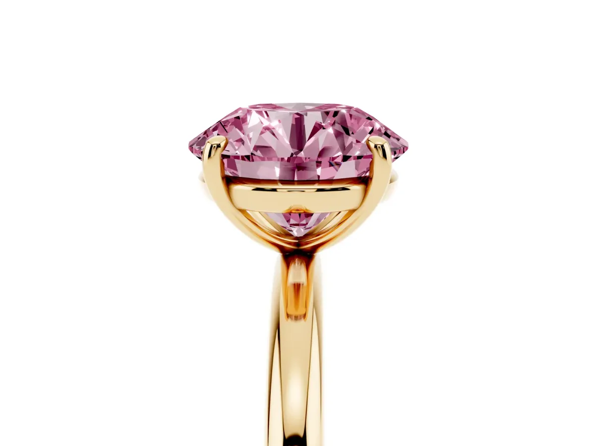 Fancy Pink Round Cut Solitaire Diamond Ring with Four-Prong Setting on a Plain Band Yellow gold