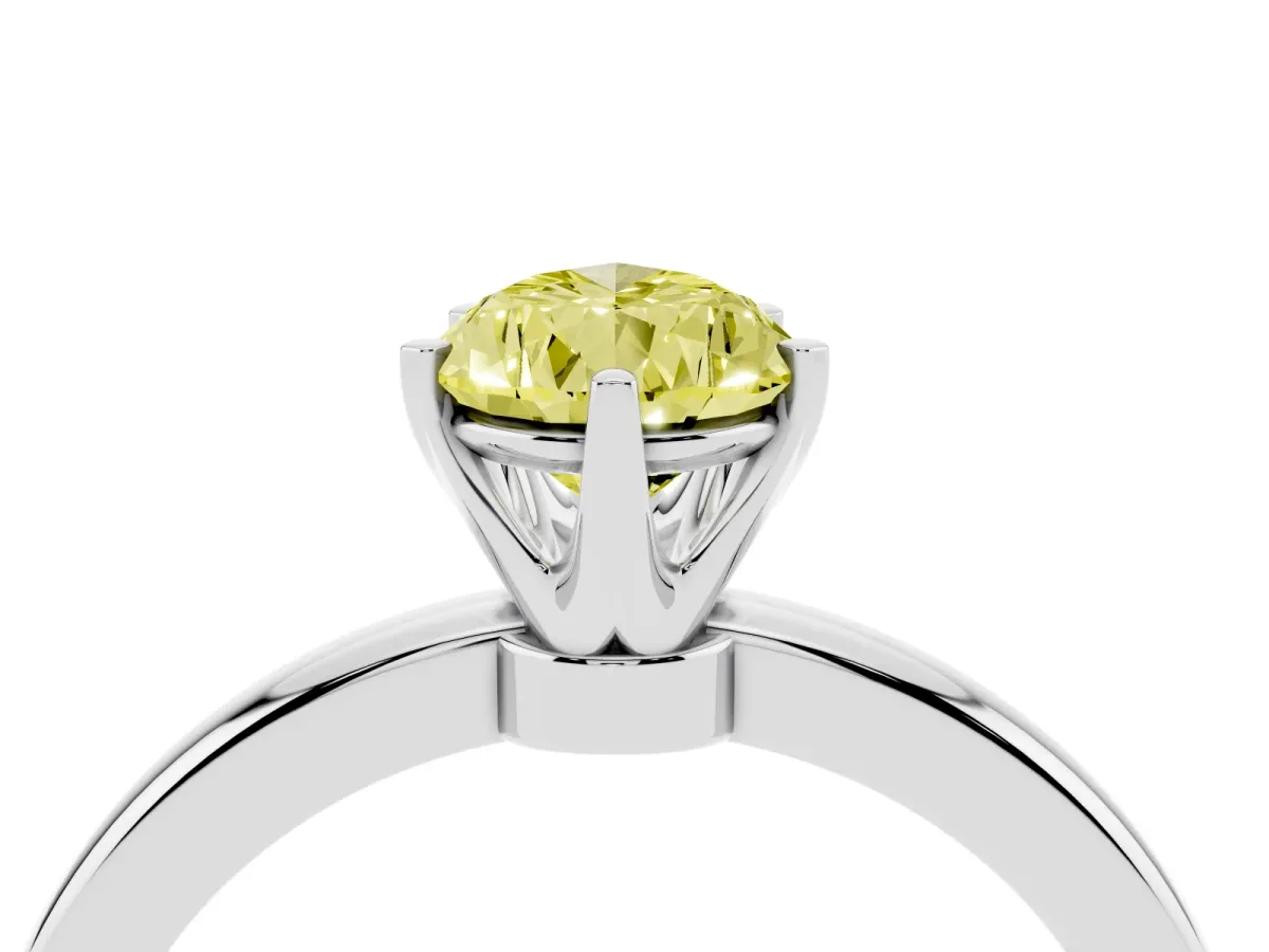 Fancy Yellow Pear Cut Solitaire Diamond Ring with Six-Prong Setting on a Classic Band Silver