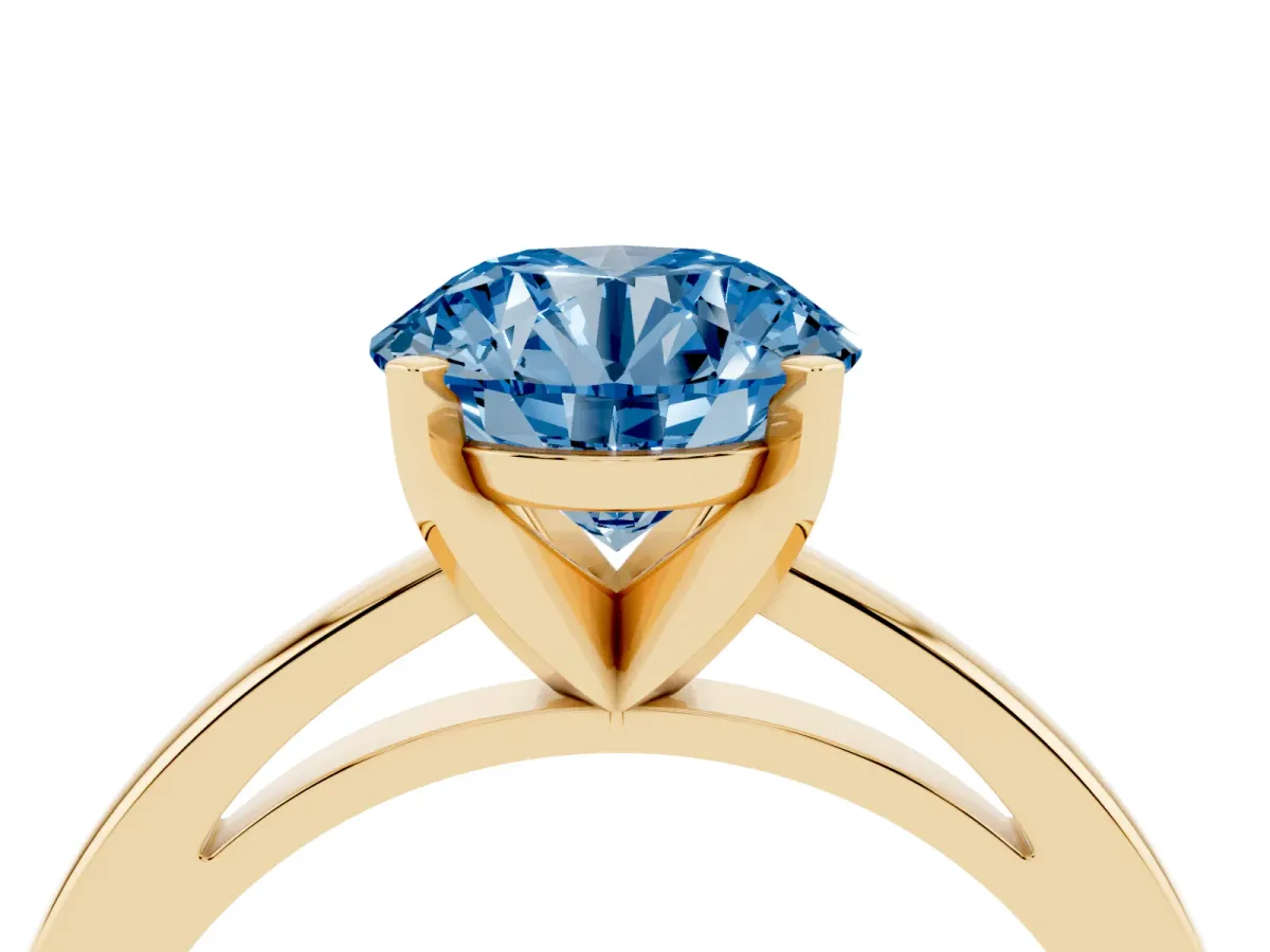 Fancy Blue Round Cut Solitaire Diamond Engagement Ring with Four-Prong Setting on a Classic Band Yellow gold